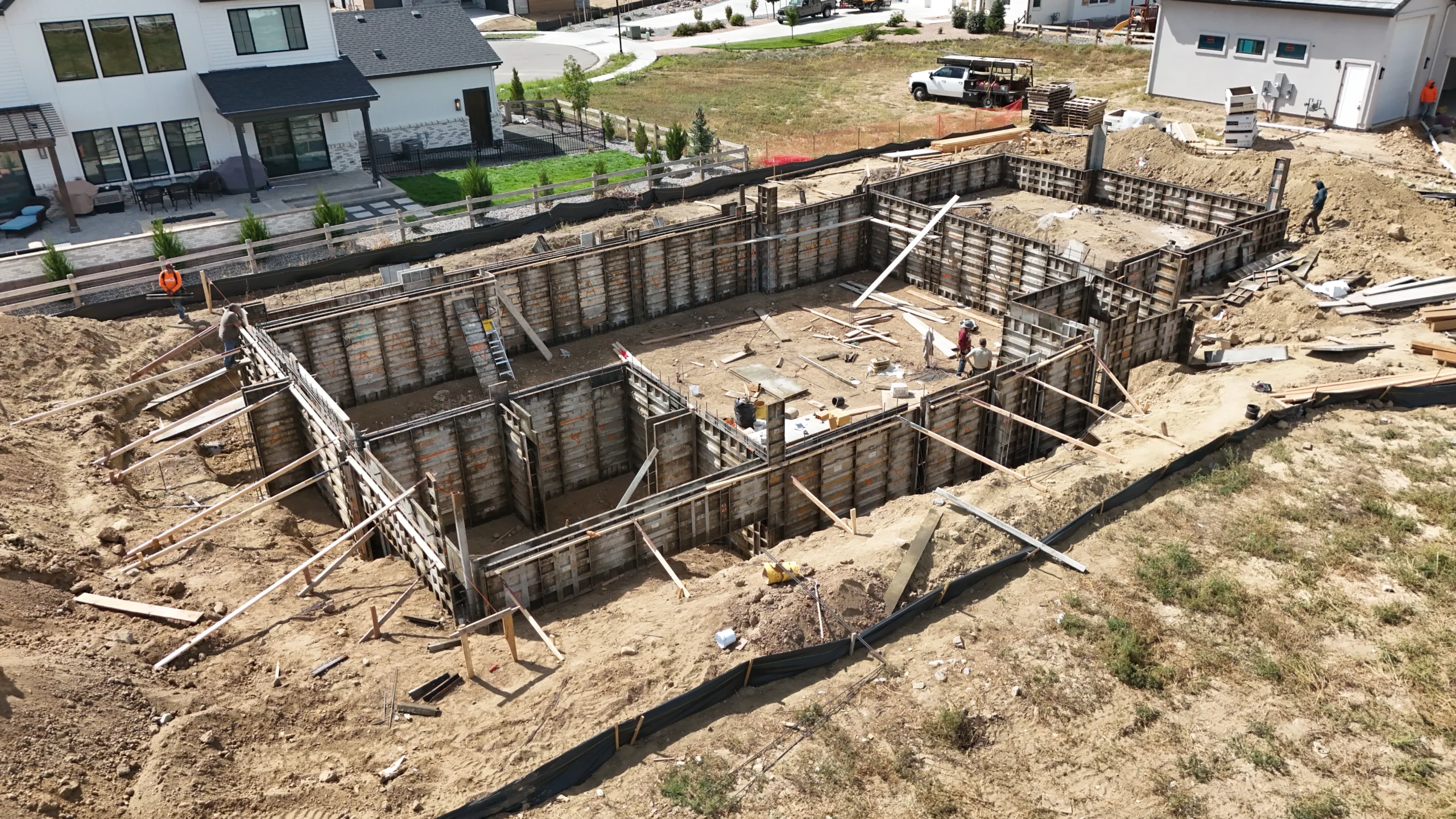 Fort August Construction foundation framing for custom home build with concrete forms and structural reinforcements